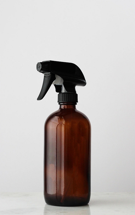 recycled amber glass sprayed bottle with black spray trigger nozzle
