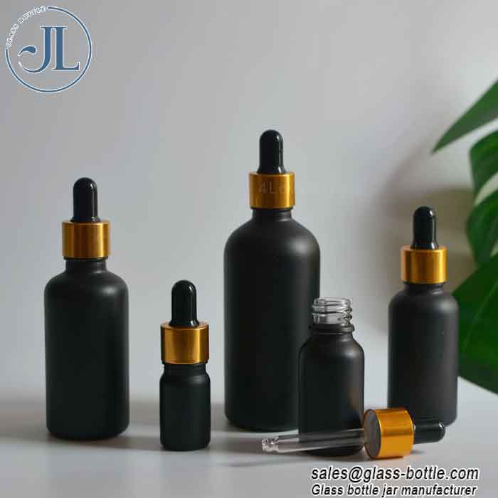 Matt black serum oil bottle with golden dropper cap