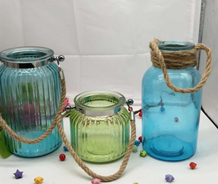 blue glass vases with hanging string