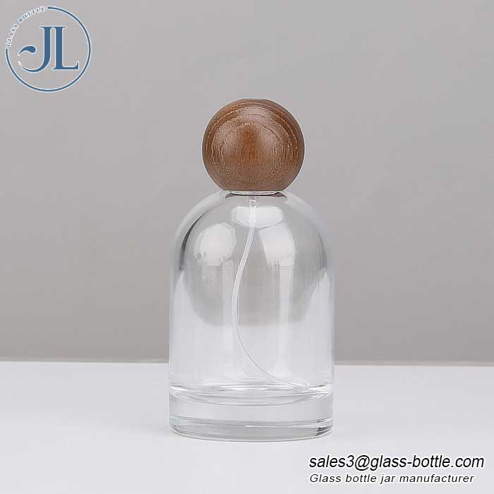 Minimalist glass spray bottle with wooden ball cap